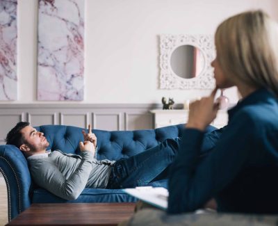 Unnerved man talking with psychologist. Consultation with a specialist.